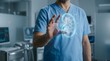 © Muhaimin  - Medical professional in blue scrubs interacts with a glowing holographic kidney, symbolizing advanced healthcare technology and futuristic organ diagnostics