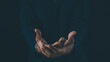 © waragron - Two open hands cupped together against a dark background, symbolizing offering, help, or receiving.