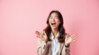© Reema - Girl screaming isolated over iteration pink background Not isolated Copy space ar Elegant asian woman