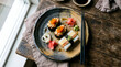 © Akash - Mixed Sushi Plate with Gunkan and Oshi Sushi on Rustic Ceramic Dish