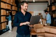© Olena Apetroaiei - Ambitious entrepreneur meticulously managing small business logistics and profits