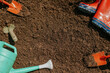 © Rawpixel.com - Gardening tools on soil with red boots and watering can