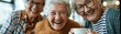 © Olga Ко - Long banner for retirement home website header: three happy senior women looking at camera, laughing and drinking tea together