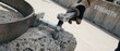 © Fernando - Concrete anchor bolt socket wrench tightening metal fastener into stone block on industrial construction site, close up of worker hand installing heavy structural hardware for strength concept details