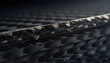 © astika - Close up view of layered carbon fiber composite material showing textured weave and rough cut edges for advanced aerospace manufacturing