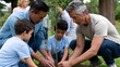 © lertputhai - Community Members Engaging in Tree Planting Activity with Children in a Green Park Setting