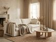 © Beaskstudios - A cozy living room scene with a sofa, coffee table, fireplace, and window with curtains, showcasing a comfortable lifestyle indoors.