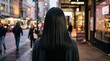© Vania Turnawan - Woman walking on busy city street during evening rush hour