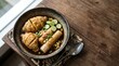 © Arip - A steaming bowl of savory Indonesian pempek, a popular fish cake dish, is presented attractively with fresh cucumber slices and flavorful noodles atop a rustic wooden table, hinting