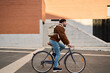 © Oscar - Man cycling a bicycle in urban environment