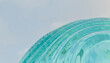 © Connect Images - Abstract view of light blue spiraling glass with a soft sky backdrop.