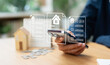 © Father_Studio - Businessman reviewing property documents and housing market information on smartphone, analyzing real estate prices, home financing options, investment value, and market trends