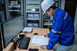 © reewungjunerr - Engineer working at control room,Manager control system,Technician man monitoring program from a lot of monitor