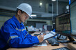 © reewungjunerr - Engineer working at control room,Manager control system,Technician man monitoring program from a lot of monitor