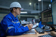 © reewungjunerr - Engineer working at control room,Manager control system,Technician man monitoring program from a lot of monitor
