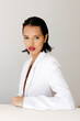 © Tania Cervian/Stocksy - Woman in white blazer with red lips