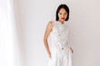 © Tania Cervian/Stocksy - Woman wearing elegant white lace top