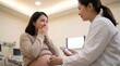 © Fiverr/fazilazia703 - Emotional pregnant Asian woman crying with joy during an ultrasound checkup with a professional female doctor in a warm clinic room, showcasing maternal care and prenatal wellness.