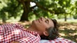 © AZ Studio - Relaxing summer afternoon under a tree with picnic blanket