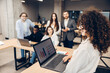 © Maria Vitkovska - Businesswoman presenting data during an office meeting