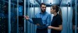 © keks20034 - Male it specialist and female technician discussing work in a data center with cloud visualization.