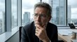 © Yuliia - Confident Senior Businessman Thinking in Modern Office City View Portrait