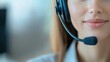 © Fahroni - Close-up of customer service representative wearing noise-canceling headset in corporate office environment. Human connection and advanced technology integration for business communication solutions.