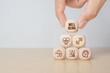 © Achmad Khoeron - Employee wellbeing concept. Hand hold wooden blocks with physical, mental, emotional health icons. Creating employee benefits. Fostering positive work culture, employee engagement