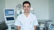 © Elena - A smiling healthcare professional in a clinic or hospital setting.