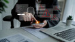 © InfiniteFlow - A user interacts with a smartphone to initiate a secure login using biometric authentication in a modern office. This image represents advanced technology and data security measures. Ledger