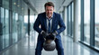 © ABAStock - Stressed businessman struggling to lift heavy corporate debt kettlebell in office hallway