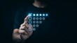 © Soyaeb - Person giving high rating feedback with glowing stars and checklist on finger