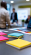 © Curioso.Photography - Colorful sticky notes on desk during business meeting with blurred presentation in background symbolizing teamwork planning and strategy