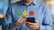 © Morgan - Man holding smartphone with emotion icons, customer satisfaction rating survey, feedback review and service quality assessment concept