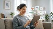 © Leo - Smiling woman using digital tablet with floating healthcare icons for telemedicine and remote patient monitoring showing heart rate calendar prescription and medical charts
