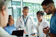 © Marko Geber - Senior doctor mentoring medical students in hospital