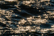 © Tetra Images - Sunlight reflected in rippled water surface