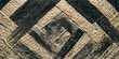 © Black Art - Intricate weave pattern of natural fibers, creating a textured background of diagonal lines and woven squares in earthy tones of black and beige, highlighting the beauty of handmade craft.
