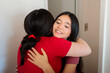 © Dani Nahuel/Stocksy - Young patient hugging midwife after consultation