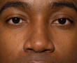© Wavebreak Media - Male staring directly, showing eyes, nose, eyebrows, eyelashes and skin pores in studio