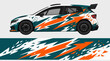 © PS STOCK - Rally car with dynamic camo wrap design.