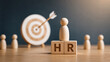 © Mitha - HR Word on Wooden Blocks with Human Figurine and Target Dartboard. Human Resource Management, Talent Recruitment, Career Headhunting, Corporate Hiring, and Staff Selection Concept.