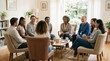© PSCREATIVE - Diverse group of people in a support group session sharing and listening attentively in a comfortable living room setting