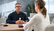 © Andrey Popov - Bail Bondsman Supports Worried Woman Signing Legal Release Form