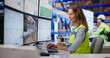 © Andrey Popov - Experienced Logistics Manager Monitors Real-time Package Flow