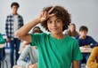 © vector_hunt - Young boy with curly hair making a peace sign gesture in a classroom