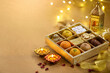 © Sri Stocks - Traditional Indian Festival Sweets Gift Box With Diya Lamps