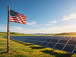© Anastasia - American flag on flagpole in front of vast solar panel farm on green grass field under clear blue sky with clouds, USA renewable clean energy sustainability and green power concept.