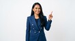 © MUNAWAR - A smiling woman in a blue blazer pointing upwards in a studio.