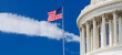 © kosoff - United States Flag Flying Beside US Capitol Dome Under Blue Sky
